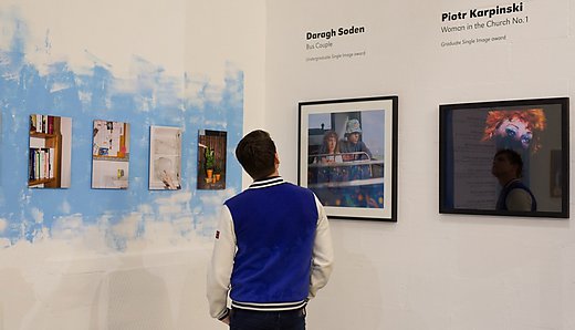 Man looking at artwork in exhibition