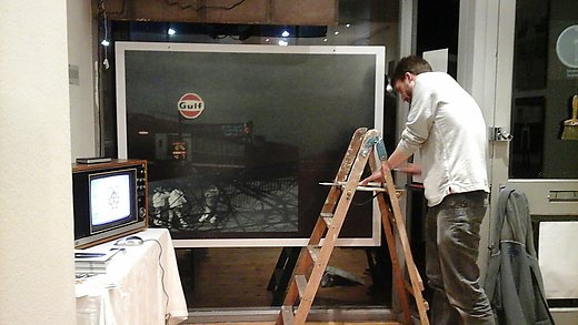 Installation of Seven Day Suit Man installing exhibtion